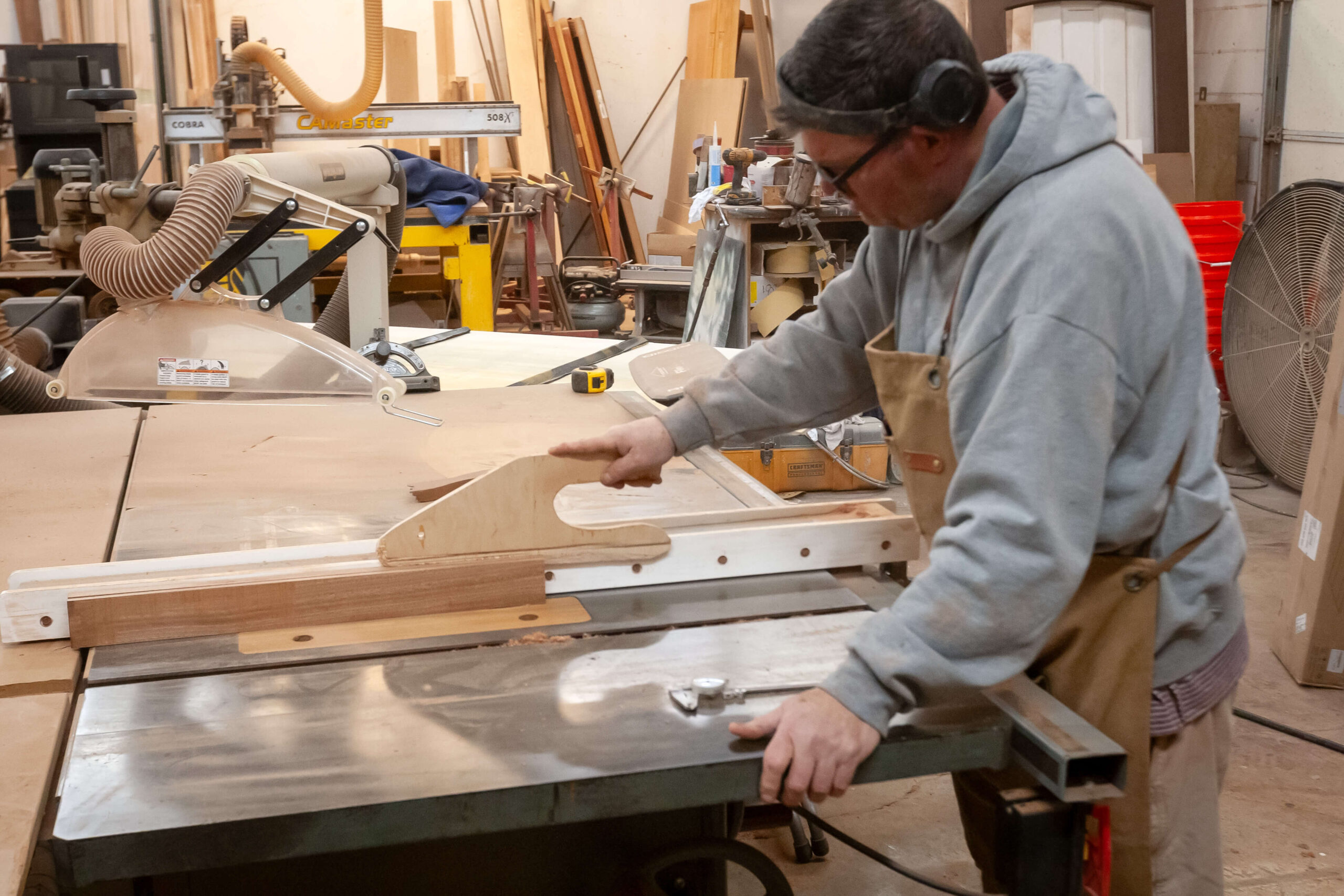 Scobis craftman working on door